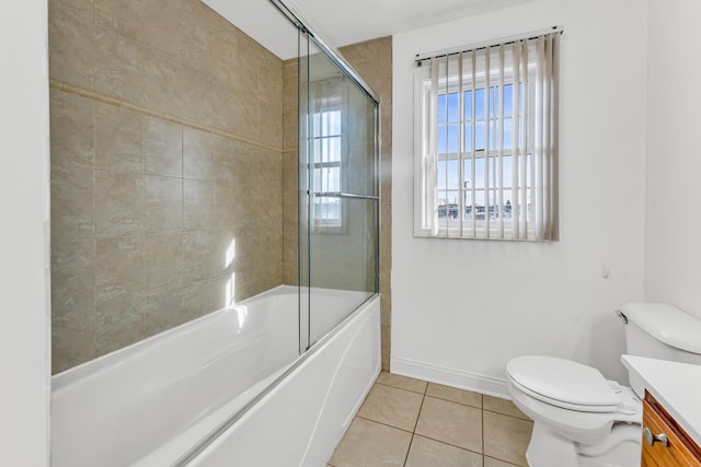 full bathroom featuring tile patterned flooring, vanity, enclosed tub / shower combo, and toilet