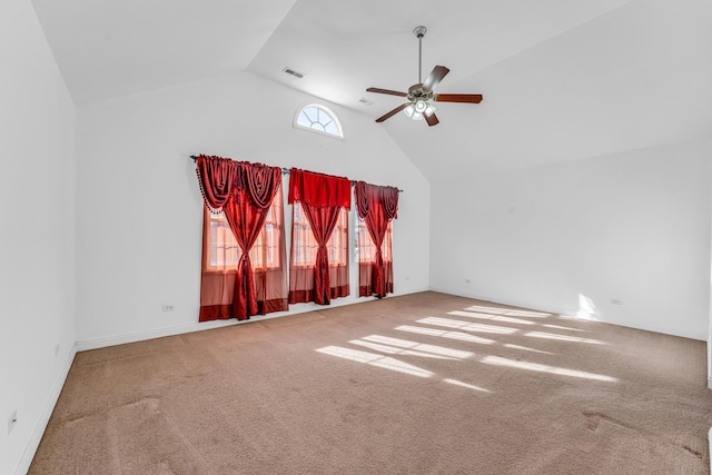 unfurnished room featuring ceiling fan, carpet floors, and high vaulted ceiling