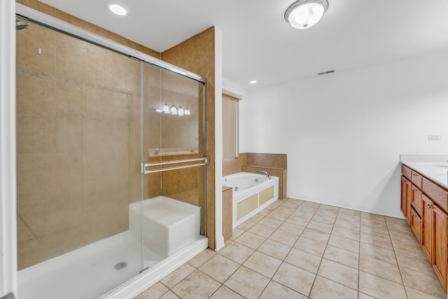 bathroom featuring vanity, tile patterned floors, and plus walk in shower