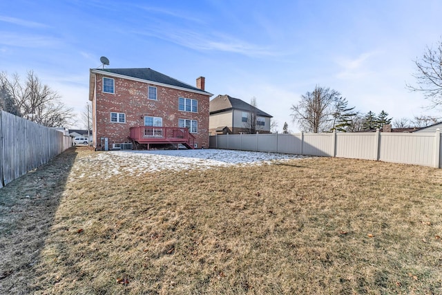 rear view of property with a yard