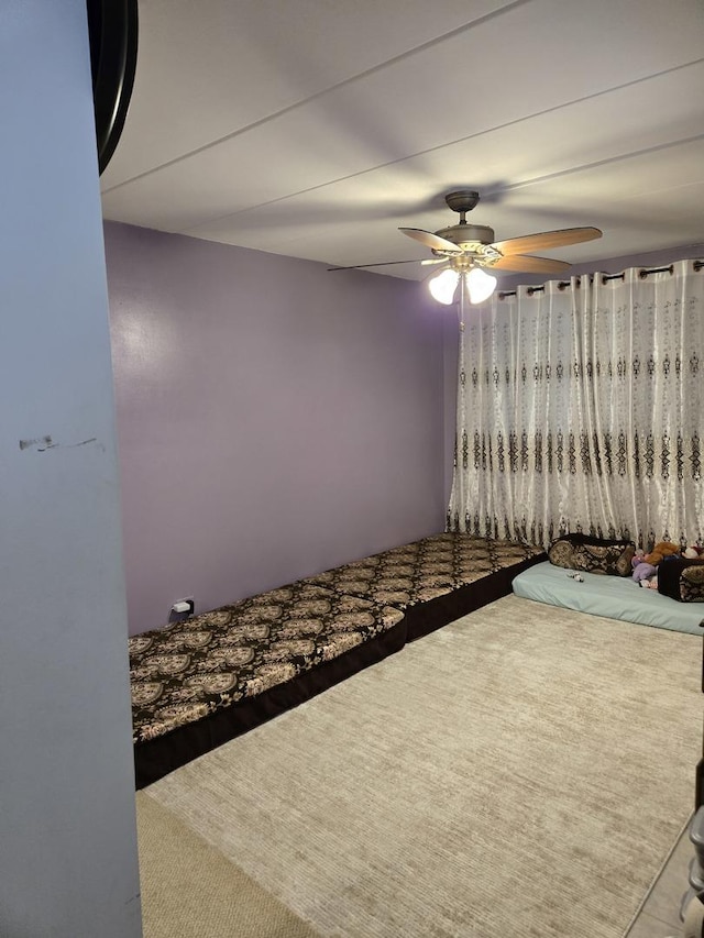 unfurnished bedroom featuring ceiling fan