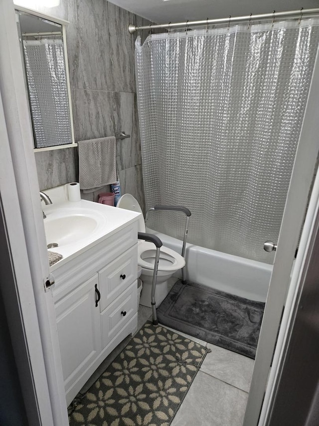 full bathroom with toilet, vanity, tile patterned floors, and shower / bathtub combination with curtain