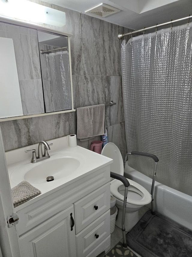 full bathroom with vanity, toilet, and shower / bath combo with shower curtain