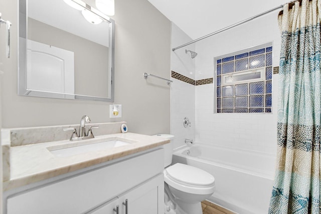 full bathroom with shower / tub combo, vanity, and toilet