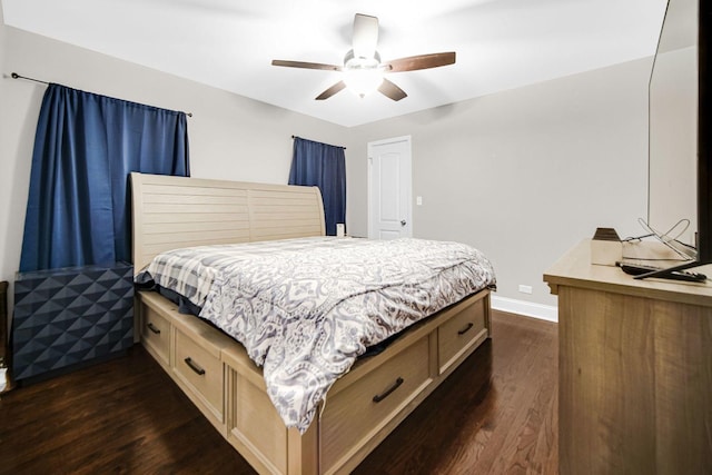 bedroom with dark hardwood / wood-style floors and ceiling fan