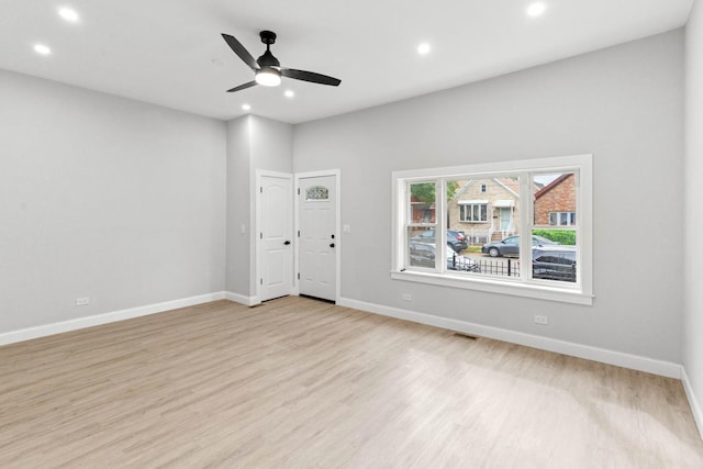 empty room featuring light hardwood / wood-style floors and ceiling fan