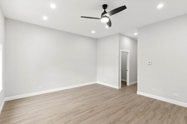 unfurnished room featuring ceiling fan and light wood-type flooring