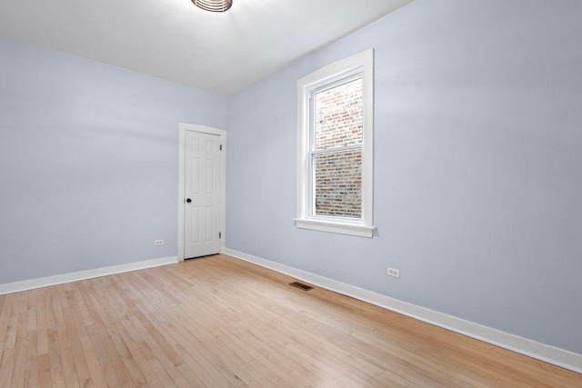 empty room with light wood-type flooring