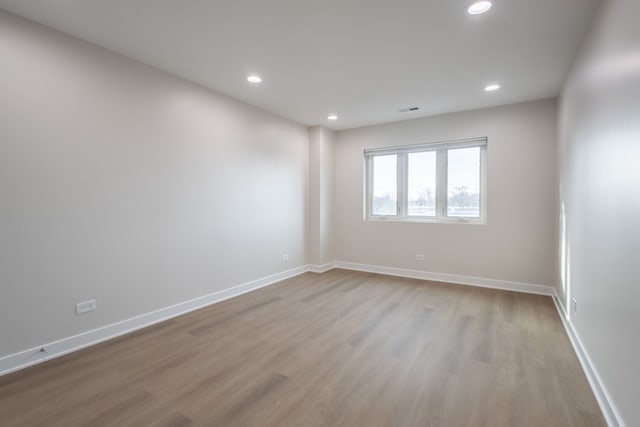 spare room with light wood-type flooring