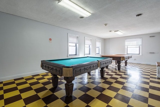 playroom featuring a textured ceiling and billiards