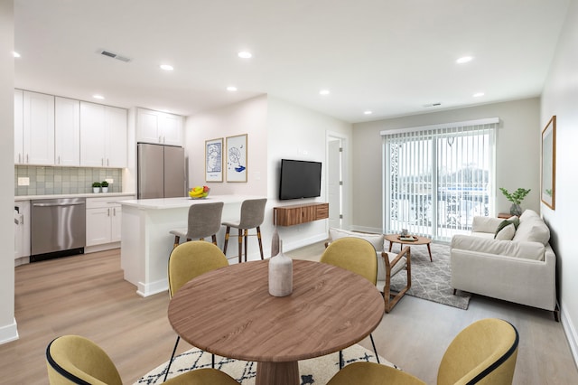 dining area featuring light hardwood / wood-style flooring