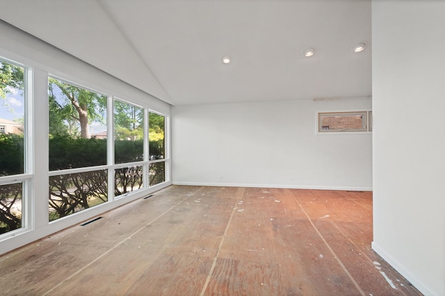 unfurnished sunroom featuring lofted ceiling