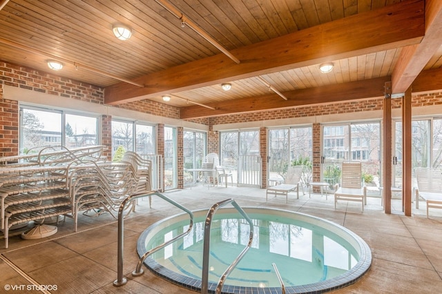 view of swimming pool with an indoor in ground hot tub