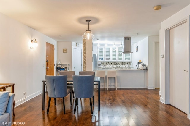 dining area featuring dark hardwood / wood-style floors