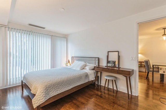 bedroom featuring dark hardwood / wood-style floors