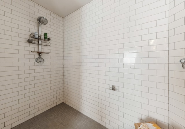 bathroom with tiled shower