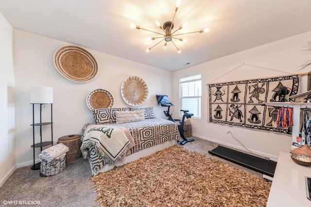 carpeted bedroom featuring a chandelier