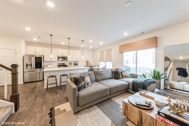 living room with dark wood-type flooring