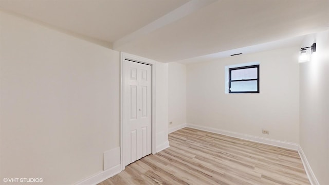 spare room with light hardwood / wood-style flooring