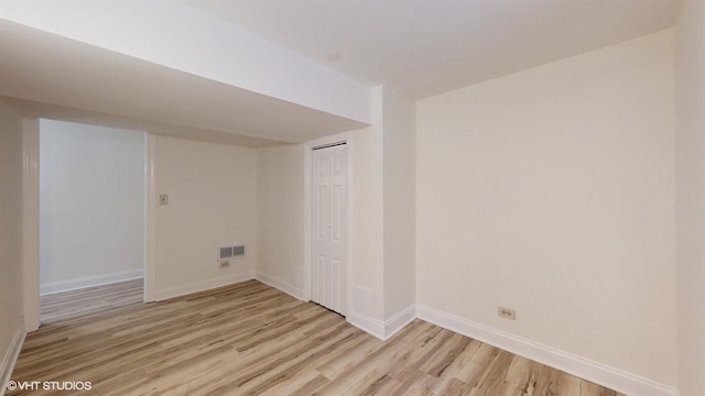 basement featuring light hardwood / wood-style flooring