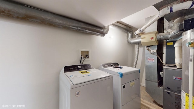 laundry room featuring washing machine and clothes dryer