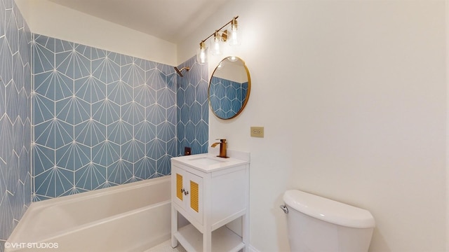 full bathroom with tiled shower / bath combo, vanity, and toilet