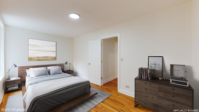 bedroom with light hardwood / wood-style floors