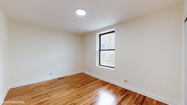 unfurnished room featuring light hardwood / wood-style floors