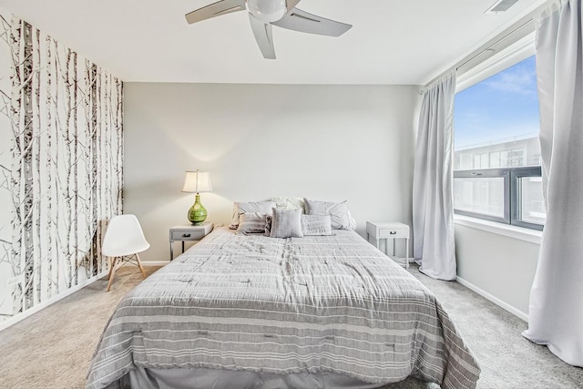 bedroom featuring light carpet and ceiling fan