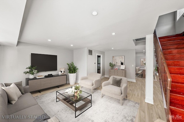 living room with light hardwood / wood-style flooring