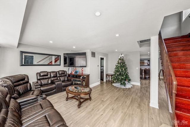 living room with light hardwood / wood-style flooring