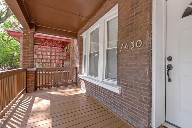 wooden terrace with covered porch