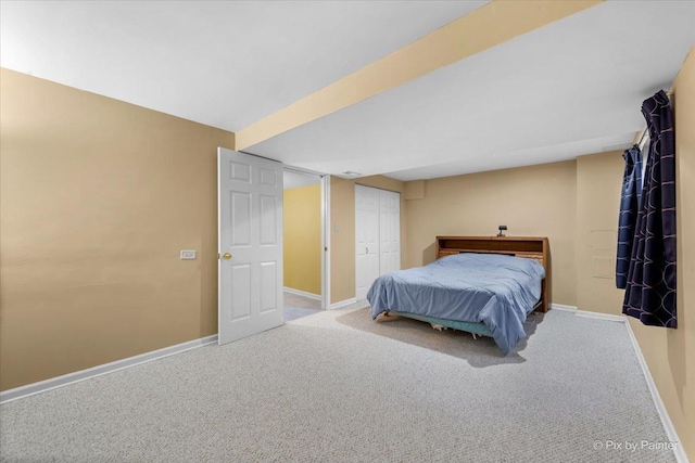 carpeted bedroom featuring a closet