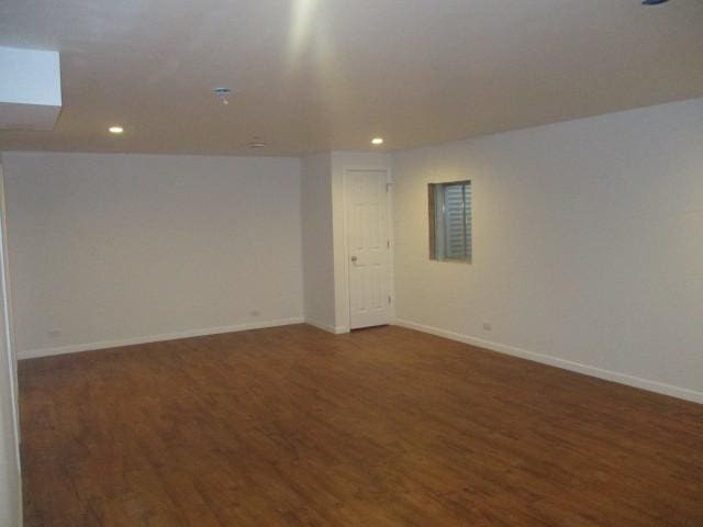 basement featuring dark hardwood / wood-style floors