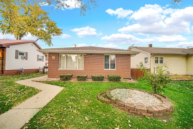 view of front of home with a front lawn