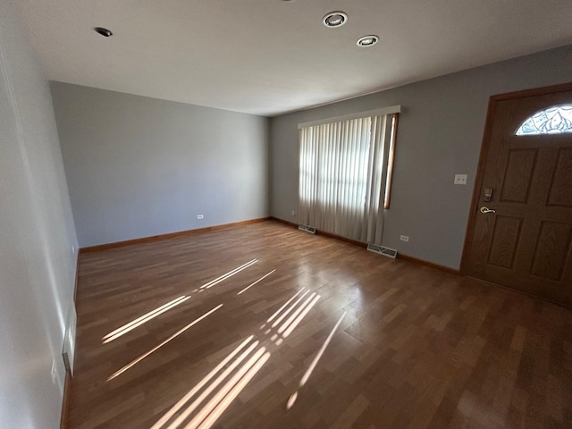 foyer with dark hardwood / wood-style floors