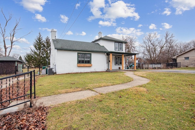 view of front of house featuring a porch, central air condition unit, and a front yard