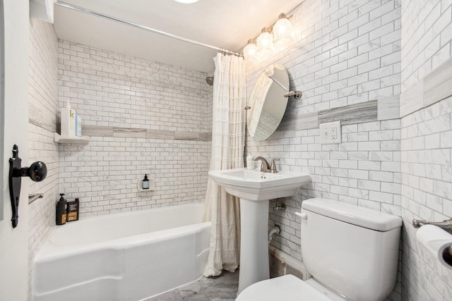 bathroom with toilet, tile walls, and shower / bath combo with shower curtain