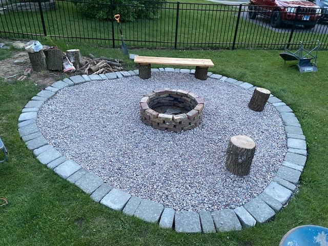 view of yard with a fire pit