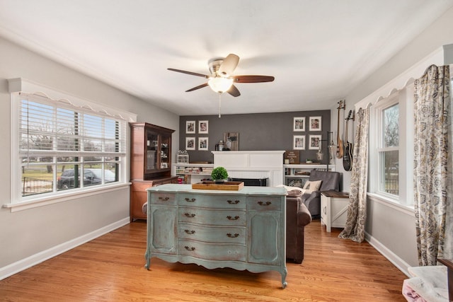 interior space featuring ceiling fan and light hardwood / wood-style flooring