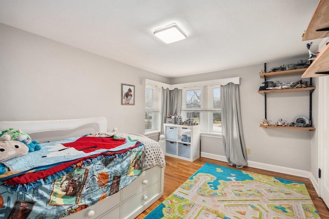 bedroom featuring wood-type flooring