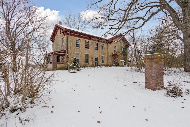 view of snow covered house