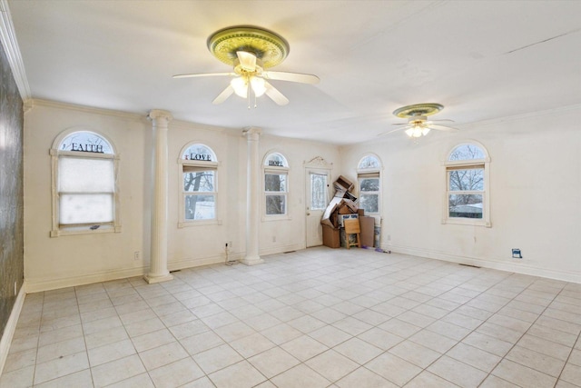 tiled empty room with decorative columns, ceiling fan, and crown molding