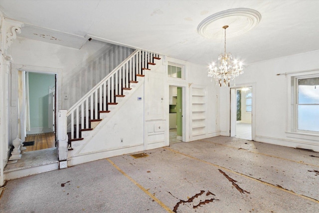 entryway featuring a chandelier