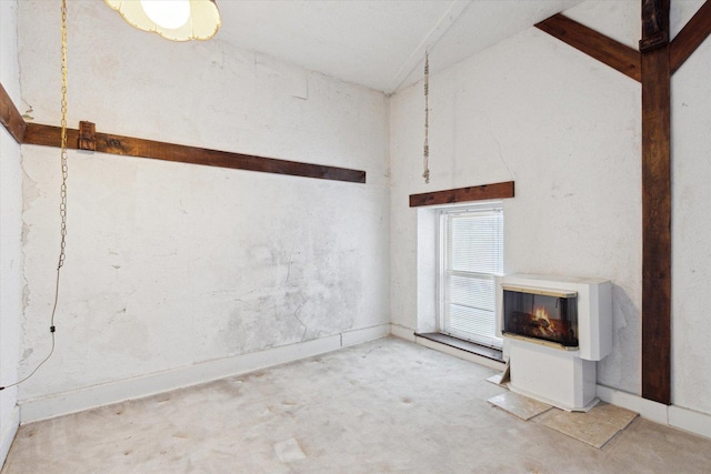 unfurnished living room with vaulted ceiling