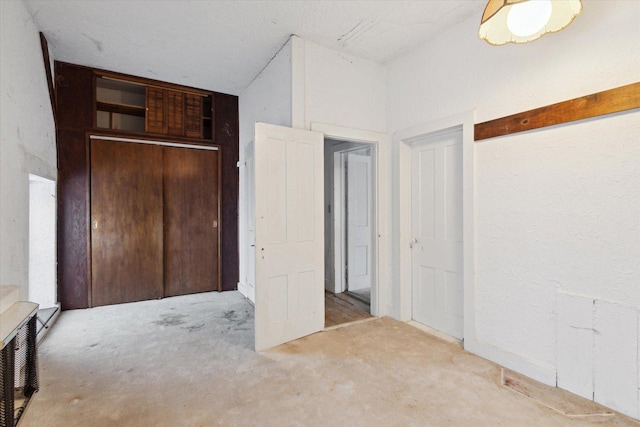 unfurnished bedroom featuring a closet and carpet floors