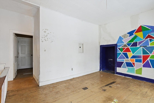 unfurnished room with wood-type flooring