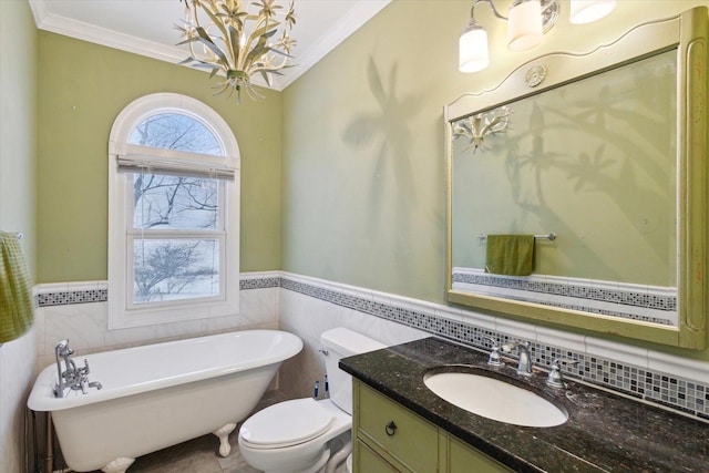 bathroom featuring a tub to relax in, toilet, tile walls, and ornamental molding