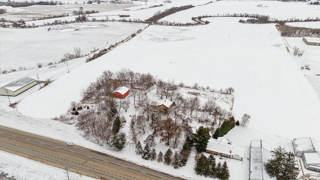 snowy aerial view featuring a rural view