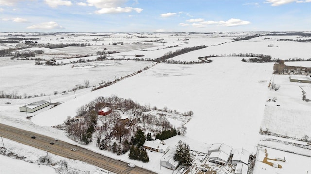 snowy aerial view with a rural view